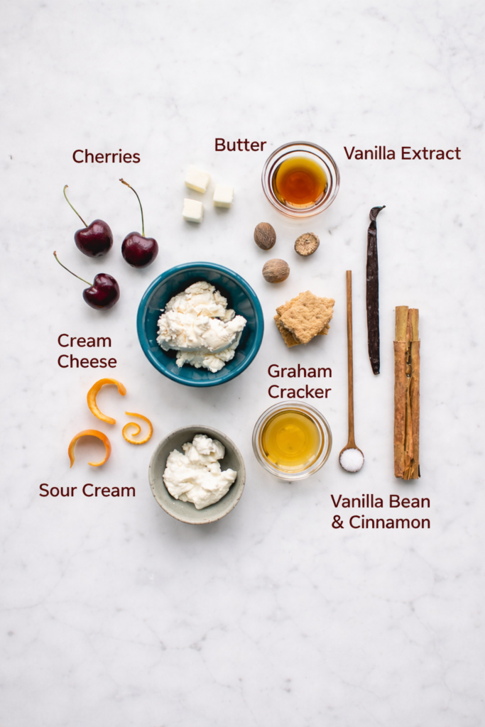 Ingredients for delicious cherry cheesecake at home laid out on kitchen counter