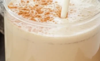 Homemade chai tea latte Starbucks copycat served in a glass mug with cinnamon and star anise